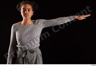 Zahara  1 arm dressed flexing front view grey sweatshirt…